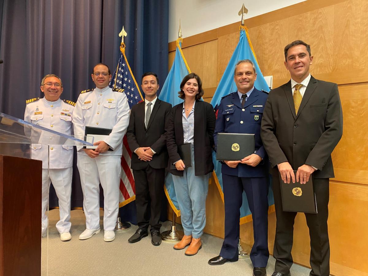A group of Brazilian participants receive their certificates of completion for the 2022 Cybersecurity Policy in the Americas: Challenges for Policy-Strategic Analysis Course at the Perry Center located at National Defense University. (Photo: Darla Jordan/Perry Center)