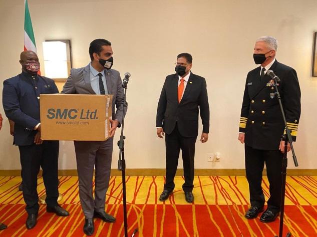 In Suriname, U.S. Navy Admiral Craig S. Faller (R), SOUTHCOM commander, joined President Chan Santokhi (C) and Health Minister Amar Ramadhin (second from L) on January 13, 2021, to turn over $588,000 in donated medical equipment to bolster the country’s COVID-19 response. SOUTHCOM’s Humanitarian Assistance Program funded the donation. (Photo: SOUTHCOM Twitter)
