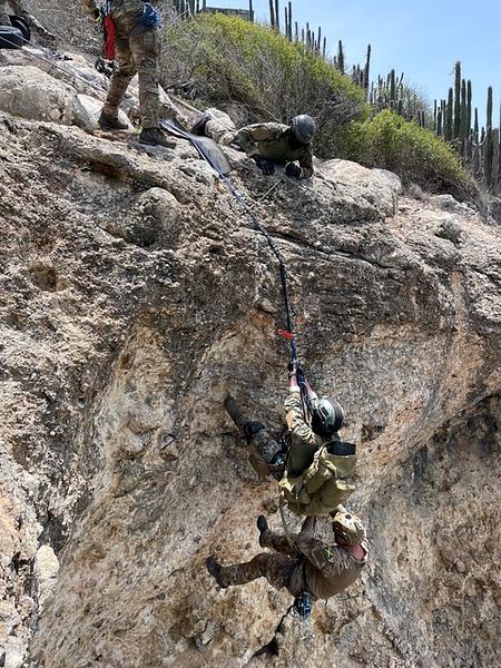 Members of the 571st MSAS train in advanced tactical combat casualty care (TCCC) capabilities with the JDF. The training focused on accessing casualties in restricted terrain by challenging students through myriad of exercises requiring construction of rigging and rope systems. (Photo: JDF/571st MSAS)