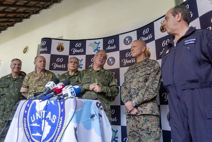 Brazilian Navy (MB, in Portuguese) Rear Admiral Leonardo Puntel and Major General Michael F. Fahey III, commander of U.S. Marine Corps Forces, South, attend a press conference during UNITAS 2019. Argentinian and Brazilian high-ranking officers stand to the left of MB’s chief of Naval Operations. (Photo: Wagner Ziegelmeyer, Cria Studios)