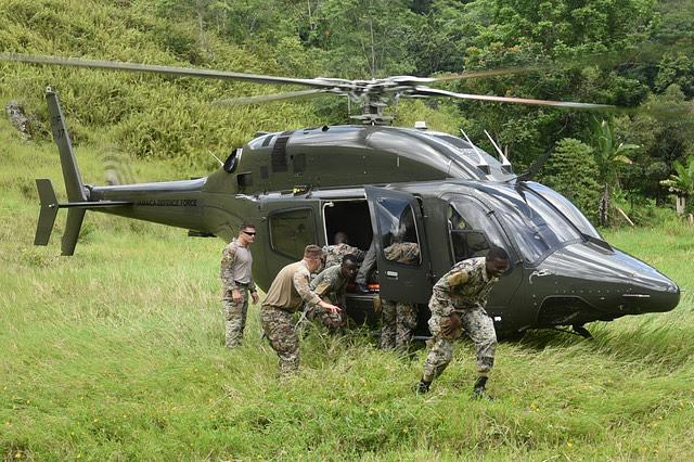 Members of the U.S. Air Force’s 571st Mobility Support Advisory Squadron (MSAS) train MEDEVAC capabilities with the Jamaica Defence Force’s (JDF) Disaster Assistance Relief Team (DART) and the JDF Rotary Wing, during a summer 2022 engagement carried out in northern Jamaica. (Photo: JDF/571st MSAS)
