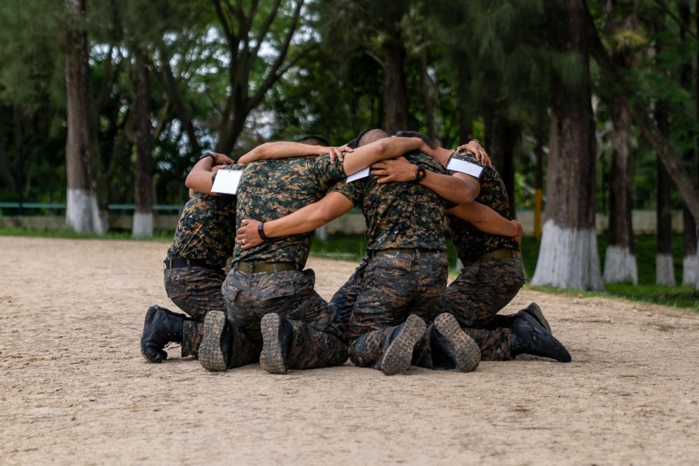 Guatemala team members huddle together before competing in the first event for Fuerzas Comando 2022, the Physical Training Test, on June 13, 2022, in Tegucigalpa, Honduras. (Photo: U.S. Air Force Technical Sergeant Lionel Castellano)