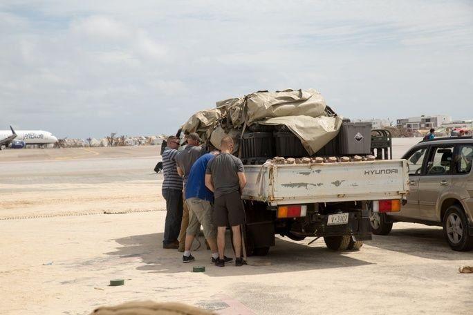 U.S. marines with Joint Task Force-Leeward Islands unload the parts for a Lightweight Water Purification System from a box truck at a water purification site on Saint Martin, on September 14th. The system allows the marines to purify approximately 1,800 gallons of water a day in order to supply communities on the island affected by Hurricane Irma. At the request of partner nations, JTF-LI deployed aircraft and service members to areas in the eastern Caribbean Sea affected by Hurricane Irma. The task force is a U.S. military unit composed of marines, soldiers, sailors, and airmen, and represents U.S. Southern Command’s primary response to Hurricane Irma. (Photo: U.S. Marine Corps Sergeant Ian Leones)