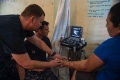 U.S. Navy Lt. Cmdr. Nicholas Sweet, a radiologist assigned to Naval Hospital Camp Lejeune, North Carolina, performs an ultrasound on a Honduran patient at the CP-17 medical site in Trujillo, Honduras. (Photo: Mass Communication Specialist 2nd Class Brittney Cannady/U.S. Navy Combat Camera)
