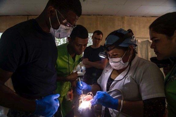U.S. Navy Hospital Corpsman 3rd Class O'neal James, assigned to Naval Hospital Jacksonville, Florida, performs dental work on a Honduran patient at the CP-17 medical site in Trujillo, Honduras, the second scheduled stop for this year’s CP mission. (Photo: Mass Communication Specialist 2nd Class Brittney Cannady/U.S. Navy Combat Camera)