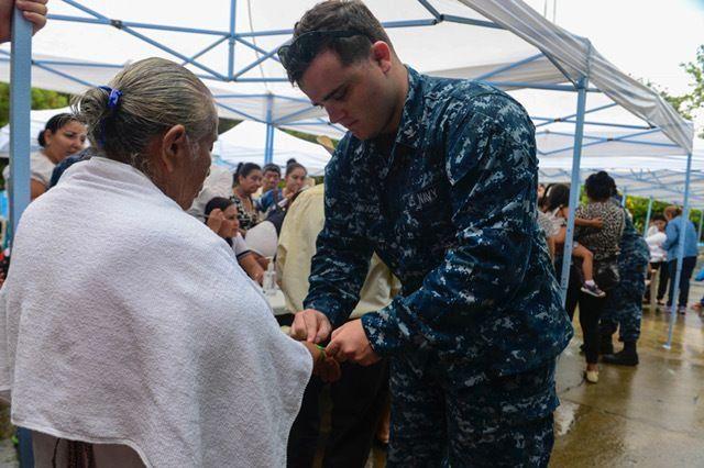 U.S. Navy Hospital Corpsman 3rd Class Dillon McDonough, assigned to Naval Hospital Jacksonville, Florida, places a registration band on a host nation patient at the CP-17 medical site in Puerto Barrios, Guatemala. (Photo: Petty Officer 2nd Class Brittney Cannady/U.S. Navy Combat Camera)