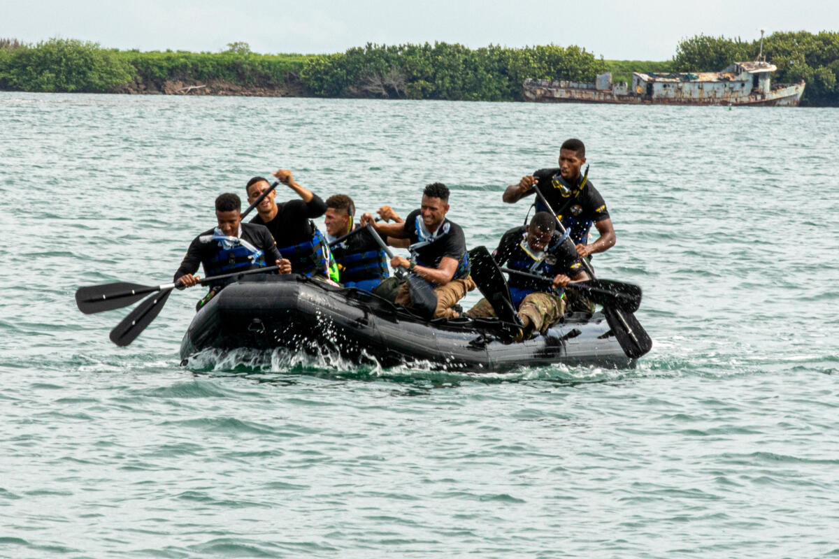 Team Dominican Republic rows a FC470 Combat Rubber Raiding Craft during the Aquatic Run-and-Shoot event of Fuerzas Comando 2024 (FC24) in Fort Sherman, Panama, May 21, 2024. FC24, hosted by the Panama Ministry of Security, May 13-24, saw competitors from 17 countries from around the Western Hemisphere conduct a 1,000-meter swim, 1,000-meter row, 6.2-kilometer ruck march, and a pistol marksmanship challenge, with all teams racing for the fastest completion time. Fuerzas Comando is a U.S. Southern Command-sponsored special operations skills competition conducted annually by Special Operations Command South. Through friendly competition, this exercise promotes military-to-military relationships, increases training knowledge, and improves regional security. (Photo: U.S. Army National Guard Staff Sergeant Scott Fletcher)