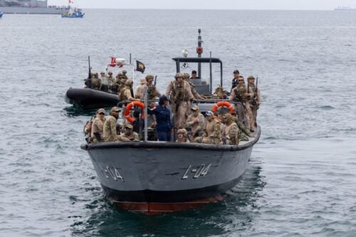 Twenty-four nations and more than 5,000 military personnel came together in Peru September 10-23, for UNITAS 2026, the 67th iteration of the world’s longest-running annual multinational maritime exercise. Hosted by Peru and sponsored by U.S. Naval Forces Southern Command/U.S. 4th Fleet, the two-week exercise brought partner forces together across maritime, amphibious, air, land, riverine, cyber, and humanitarian assistance and disaster response operations. Through complex, scenario-driven operations, participating forces strengthened interoperability, exchanged expertise, and practiced the coordination required to respond together to shared security challenges across the Western Hemisphere. The following images offer a glimpse of some of the training conducted by partner nations during UNITAS 2026. U.S. Marines with Force Reconnaissance Company, 4th Marine Division and partner nation service members travel by boat during UNITAS 2026, at Callao Naval Base, Peru September 18, 2026. (Photo: U.S. Marine Corps Corporal Breysson Villacortacampos)