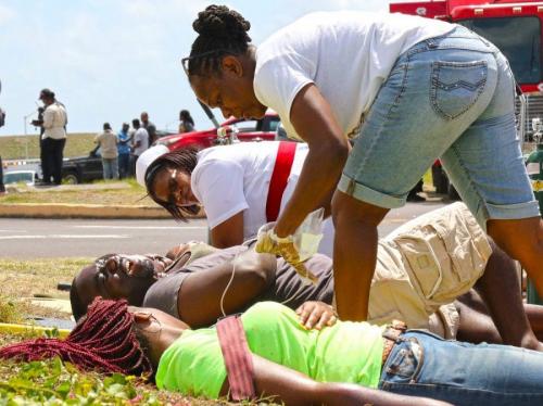 St. Kitts and Nevis Health Services personnel prepare simulated victims of an airplane crash for transportation to the hospital during Tradewinds 2018, June 9, 2018, in Basseterre, St. Kitts. (Photo: U.S. Army National Guard Staff Sgt. Shane Hamann, 102nd Public Affairs Detachment)