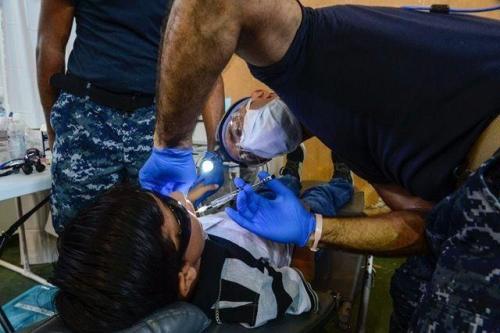 U.S. Navy Lt. Farid Hamidzadeh, a dentist assigned to Naval Hospital Jacksonville, Florida, administers a topical numbing agent to a patient at the CP-17 medical site in Puerto Barrios, Guatemala. (Photo: Petty Officer 2nd Class Brittney Cannady/U.S. Navy Combat Camera)CP-17 is a U.S. Southern Command-sponsored and U.S. Naval Forces Southern Command/U.S. 4th Fleet-conducted deployment to conduct civil-military operations including humanitarian assistance, training engagements, and medical, dental, and veterinary support in an effort to show U.S. support and commitment to Central and South America.