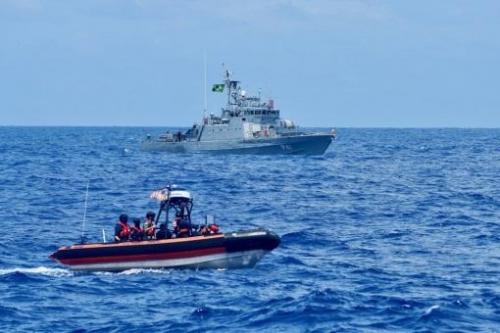 A small boat crew from the USCGC Stone (WMSL 758) navigates alongside the Brazilian Navy ship Guaíba off the coast of Northern Brazil on January 4, 2021. The Stone and the Guaíba partnered to share and practice law enforcement and rescue tactics as part of Operation Southern Cross. (Photo: U.S. Coast Guard Petty Officer Third Class John Hightower)