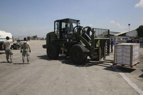 Airmen deployed in support of Joint Task Force Matthew unload supplies provided by USAID at Port-au-Prince, Haiti, on October 8th, 2016.Service members with JTF Matthew successfully delivered over 39,000 pounds of supplies to the local population affected by Hurricane Matthew, utilizing CH-53E Super Stallions and CH-47 Chinooks. (Photo: Sgt. Ian Ferro/U.S. Marine Corps Forces South)