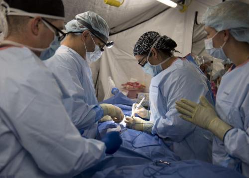 U.S. Navy Captain Rob Ricca and U.S. Navy Lieutenant Commander Kathryn L. Rutan carry out a hernia operation at the expeditionary medical unit in Puerto Cortés, Honduras on March 16, 2018. (Photo: U.S. Navy Specialist First Class Mike DiMestico)