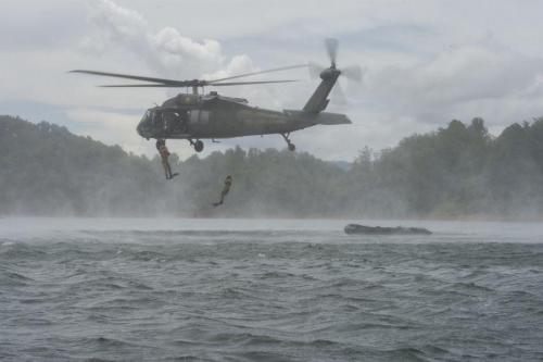 Colombian Air Force rescue troops jump from one of their UH-60 Black Hawk helicopters for a recovery exercise in water during Ángel de los Andes II, September 11, 2018. (Photo: U.S. Air Force Technical Sergeant Angela Ruiz)</br>Colombian Air Force-sponsored multinational exercise Ángel de los Andes II brought together more than 400 military, rescue, and medical personnel, as well as 21 aircraft, from the air forces of 12 nations to the highlands of Colombia, September 3-14, 2018. The exercise, in its second edition, seeks to strengthen interoperability among participants to save lives in humanitarian and natural disaster rescue missions and search and rescue in combat operations through mock situations.    