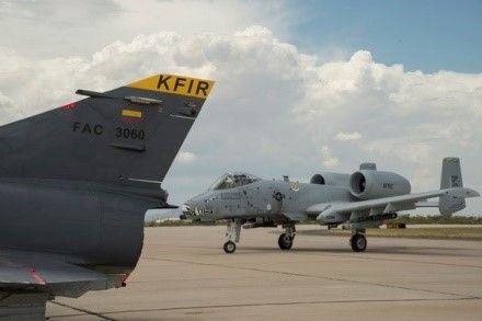 An A-10 Thunderbolt II taxies next to a Colombian Kfir fighter jet on the flighline at Davis-Monthan Air Force Base, Arizona, July 7, 2018. While at Davis-Monthan AFB, the Kfirs flew flights with A-10 Thunderbolt IIs and F-16 Fighting Falcons. (Photo: U.S. Air Force Staff Sgt. Angela Ruiz)