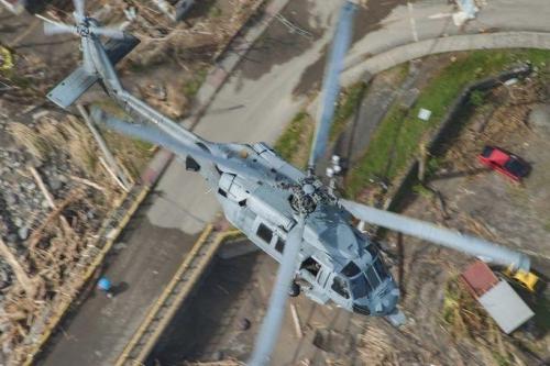An MH-60S Sea Hawk helicopter flies over the island of Dominica during U.S. citizen evacuations and humanitarian relief following the landfall of Hurricane Maria. (Photo: U.S. Navy Mass Communication Specialist Seaman Taylor King)