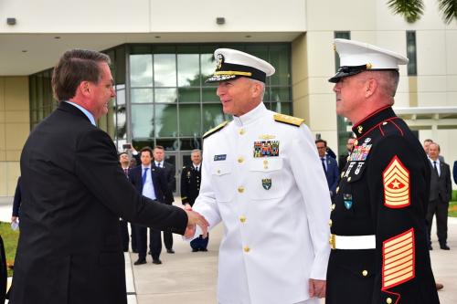 U.S. Navy Admiral Craig S. Faller (C), commander of U.S. Southern Command (SOUTHCOM) and U.S. Marine Corps Sergeant Major Bryan K. Zickefoose (R), SOUTHCOM command senior enlisted leader, greet Brazilian President Jair Bolsonaro upon his arrival at SOUTHCOM’s headquarters March 8. Bolsonaro visited SOUTHCOM to discuss the growing U.S.-Brazil defense partnership with U.S. military leaders. (Photo: Juan Chiari/SOUTHCOM)