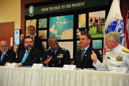 Chief of the Brazilian Armed Forces’ Joint Staff, Air Force General Raul Botelho (third from L), and U.S. Navy Admiral Craig S. Faller (R), SOUTHCOM commander, sign a bilateral agreement on Research Development, Test and Evaluation Projects that will expand opportunities to collaborate on new defense capabilities, as Brazilian President Jair Bolsonaro (fourth from L) looks on, March 8. (Photo: Juan Chiari/SOUTHCOM)