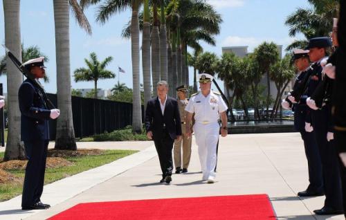 U.S. Navy Adm. Kurt W. Tidd, commander of U.S. Southern Command, escorts Colombian President Juan Manuel Santos while a U.S. military color guard renders honors shortly after the president arrived at the military headquarters to thank its personnel. (Photo: Jose Ruiz, SOUTHCOM Public Affairs)