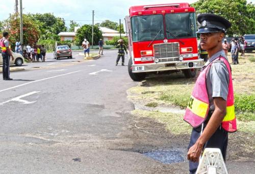 Royal St. Christopher and Nevis Police Force Constable Anson Belle conducts traffic control during an airplane crash simulation as part of Tradewinds 2018, June 9, 2018, in Basseterre, St. Kitts. (Photo: U.S. Army National Guard Staff Sgt. Shane Hamann, 102nd Public Affairs Detachment)